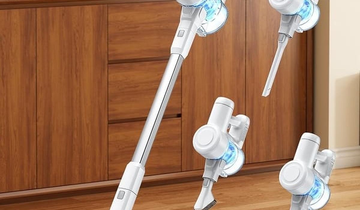 Vacuuming a mattress with a handheld vacuum attachment